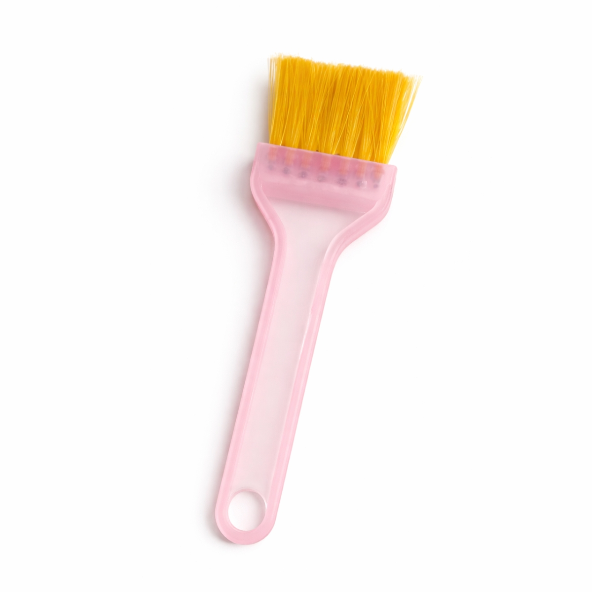 Professional flat hair dye brush with wide yellow bristles and pink plastic handle for salon hair coloring and bleaching